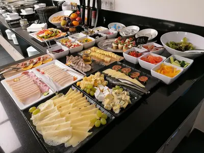 a buffet with many different types of food on a table at EA ApartHotel Melantrich in Prague