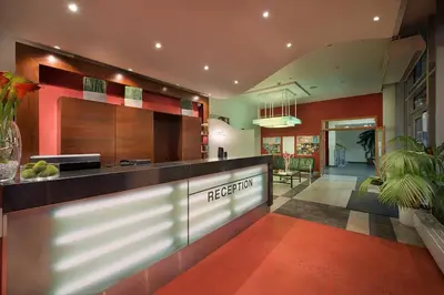 a lobby of a hotel with a reception counter at Rezidence Emmy in Prague
