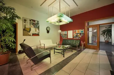 a living room with a couch and a table at Rezidence Emmy in Prague