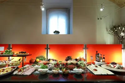 a buffet line with many different types of food at Eurostars Thalia in Prague