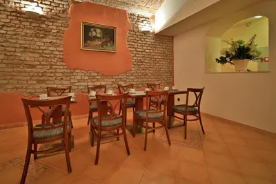 a dining room with a table and chairs at Carlton in Prague