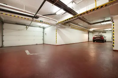 a parking garage with a car parked in it at Hotel Henrietta in Prague