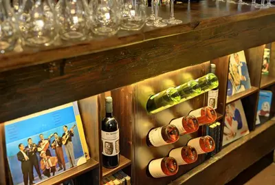 a bunch of bottles of wine on a shelf at Hotel Salvator in Prague