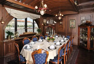 a dining room with a long table and chairs at Admiral Botel in Prague
