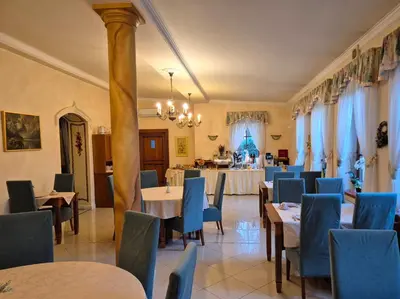 a long table with plates of food on it at Hotel Nosal in Prague