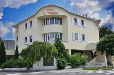 a white building with the words villa st trovez on it at Villa St. Tropez in Prague