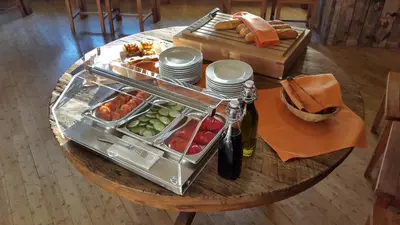 a table with a tray of food on a table at Villa St. Tropez in Prague