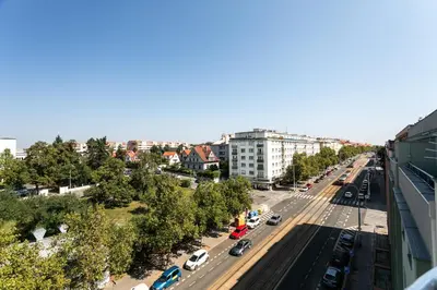 an overhead view of a city street with cars at My Hotel Apollon in Prague