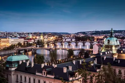 a view of the city of vienna at night at My Hotel Apollon in Prague