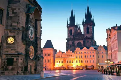a building with a clock tower and a cathedral at My Hotel Apollon in Prague