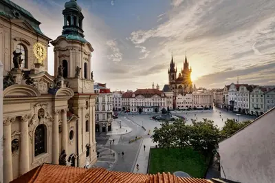 a view of the city of prague at sunset at Hotel Lippert in Prague