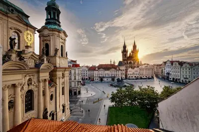 a view of the city of prague at sunset at Hotel Lippert in Prague