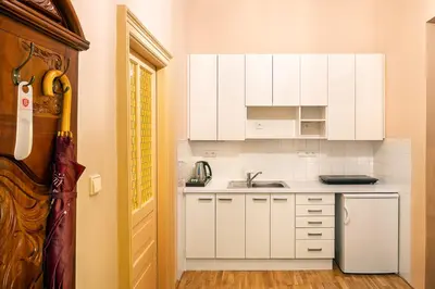 a bedroom with a bed and a mirror at BHG Apartments Prague in Prague