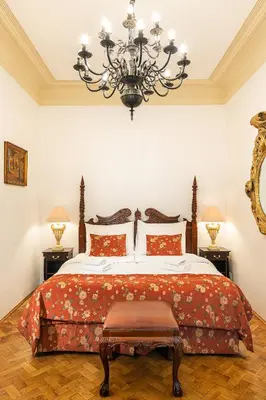 a hotel room with a couch and a bed at BHG Apartments Prague in Prague