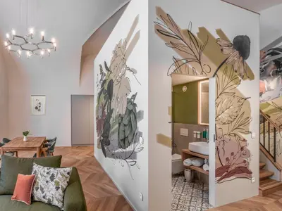 a row of buildings with a clock tower at The Botanist by Adrez in Prague