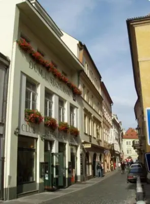 a building on a street with flowers on it at U Stare Pani - At the Old Lady Hotel in Prague
