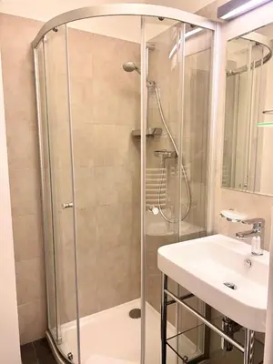a bathroom with a shower and a sink at U Stare Pani - At the Old Lady Hotel in Prague