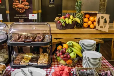 a buffet of food and fruit on a table at Hotel 