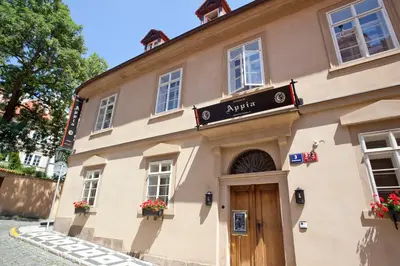 a building with a sign on the front of it at Appia Hotel Residences in Prague