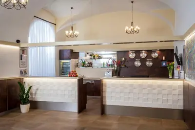 a kitchen with a counter with pots and pans at Hotel Petr in Prague