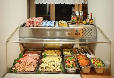 a refrigerator filled with different types of food at Residence Tabor in Prague