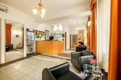 a lobby with chairs and a bar in a store at Residence Tabor in Prague