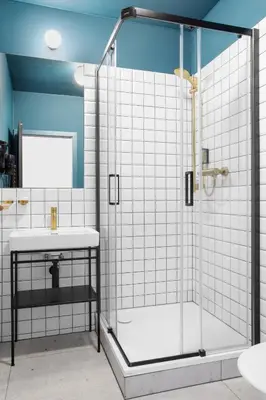 a bathroom with a shower and a sink at Hotel Beránek in Prague
