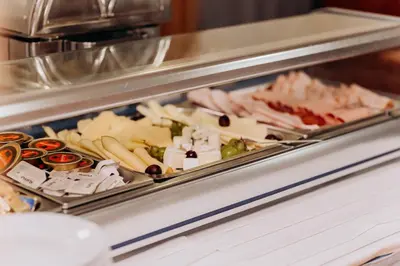 a buffet line with many different types of food at Alton in Prague