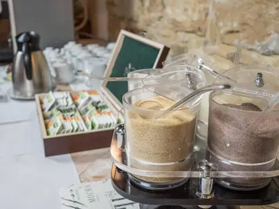 a table with two containers of food on a table at Alton in Prague