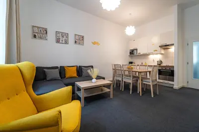 a living room with a couch and a table at Little Tom Apartments in Prague