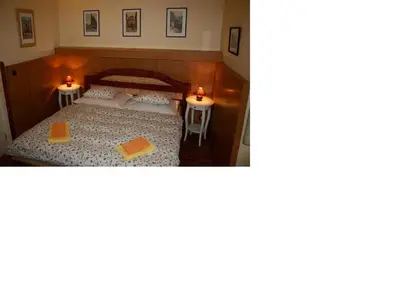 a room with a bed and two tables at Zderaz in Prague