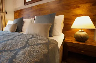 a bedroom with a bed and a lamp on a table at Hotel Residence Agnes in Prague