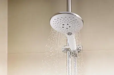 a shower head with water coming out of it at NH Prague City in Prague