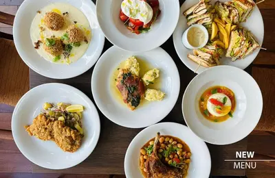 a group of plates of food on a table at COLORFACTORY SPA Hotel - Czech Leading Hotels in Prague