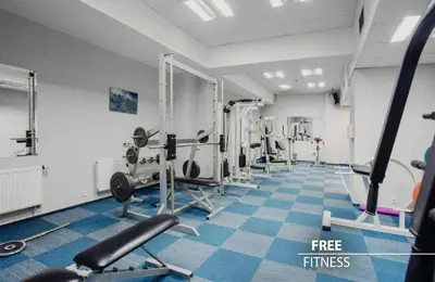 a gym with treadmills and machines in a room at COLORFACTORY SPA Hotel - Czech Leading Hotels in Prague