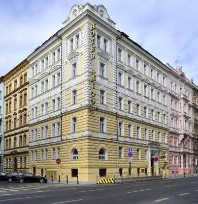 a yellow building on the side of a street at Amigo City Centre in Prague