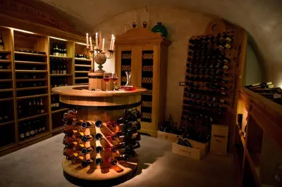 a wine tasting room with a bunch of wine bottles at Chateau Mcely in Mcely