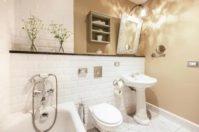 a bathroom with a toilet and a sink and a shower at Chateau Mcely in Mcely
