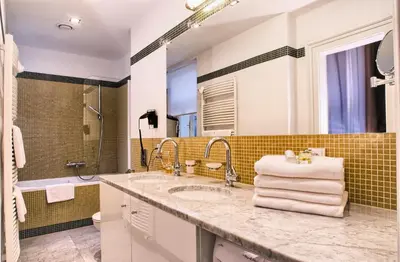a bathroom with a sink and a shower at Residence Karolina in Prague