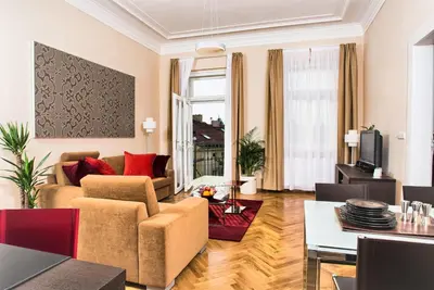a living room with a couch and a table at Residence Karolina in Prague