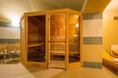 a wooden cabinet with glass doors in a room at Prague Centre Plaza in Prague