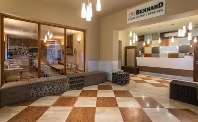 a lobby of a restaurant with a checkerboard floor at Prague Centre Plaza in Prague