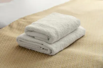 a pile of towels sitting on top of a table at Hotel Superior Prague in Prague