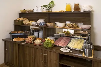 a buffet with many different types of food on it at Hotel Superior Prague in Prague