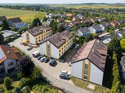 an aerial view of a small town with houses at Hotel CHOTOL in Horoměřice
