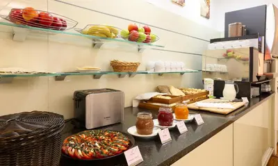 a bakery with a counter with different types of food at Amarilis in Prague
