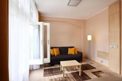 a living room with a couch and a table at Amarilis in Prague