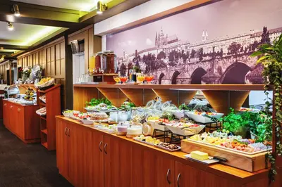 a buffet line with a lot of food on display at Charles Central in Prague