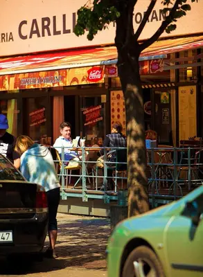 a group of people sitting at a restaurant at Charles Central in Prague