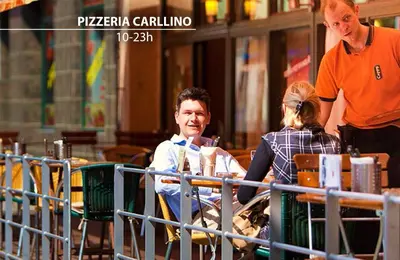 a man and a woman sitting at a table at Charles Central in Prague